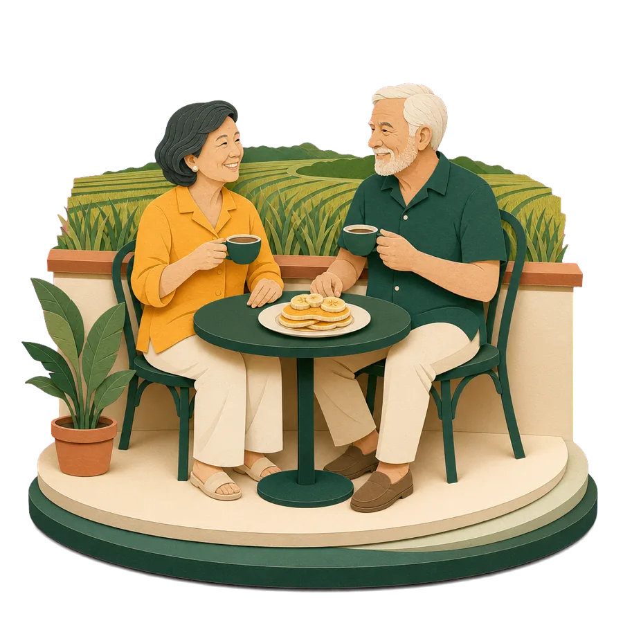 A retired couple have coffee at a cafe table beside a rice field, for the cost of a month in Ubud